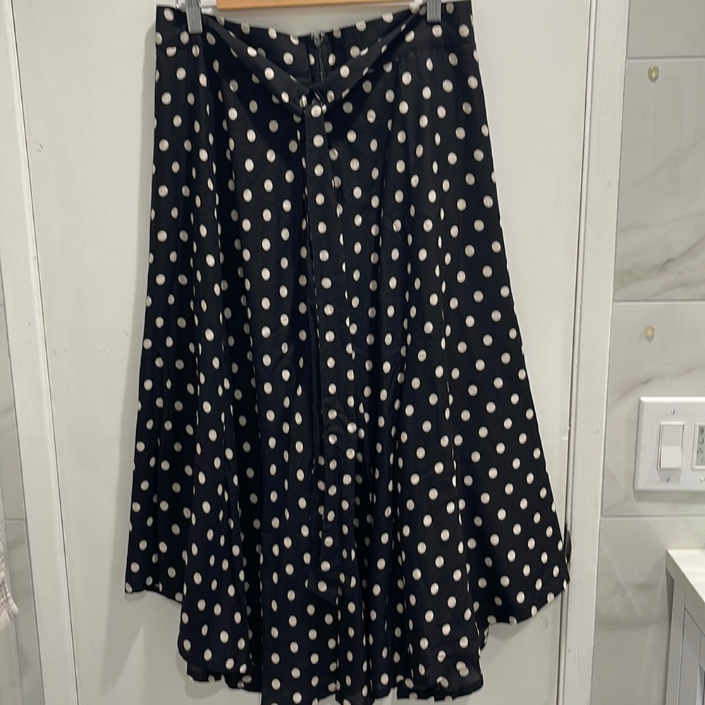 Size L.  Black and white polka dot long flair shirt